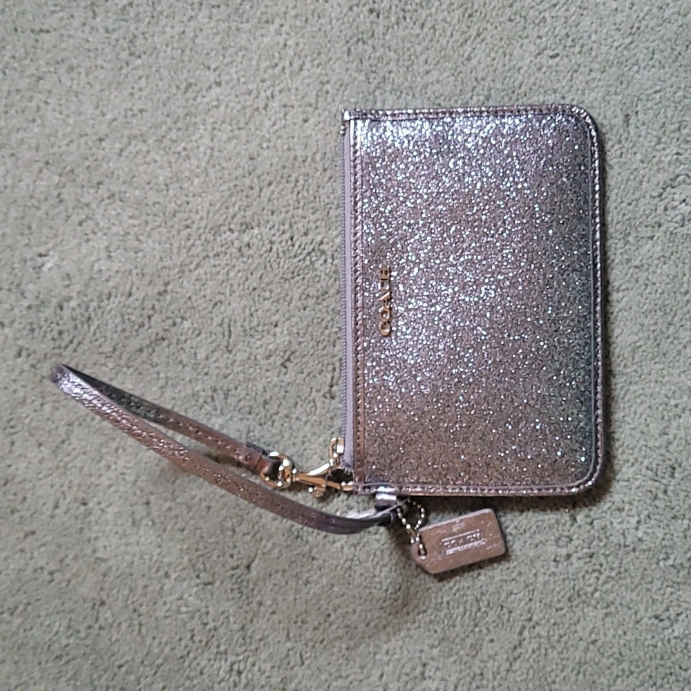EUC metallic silver Coach wristlet